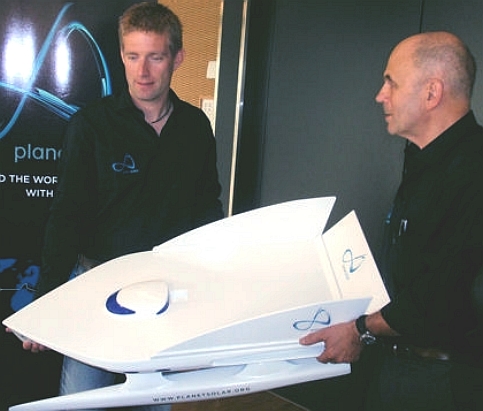 Raphael Domjan and Gerard d Aboville admire the development model of the Tranor PlanetSolar