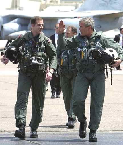President Bush, with Naval Flight Officer Lieutenant Ryan Philips, in the flight suit he wore for his televised arrival and speech aboard USS Abraham Lincoln in 2003
