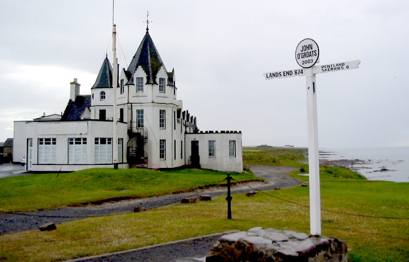 Signpost pointing to Lands End, with John  O'Groats hotel in the background