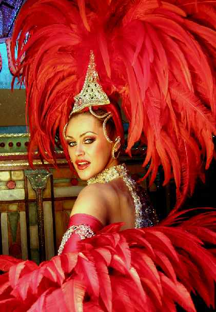 Dancer in red feather outfit Moulin Rouge, Paris, France