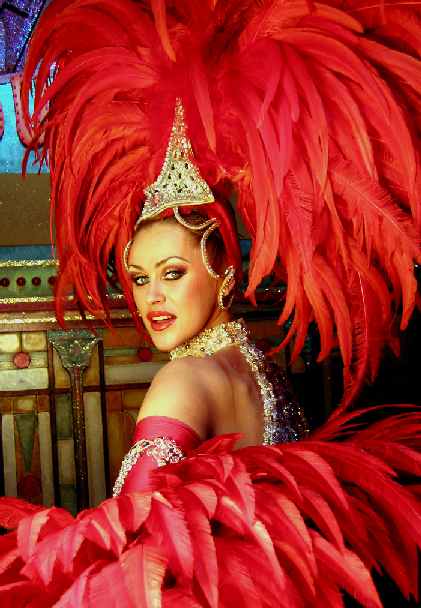 Dancer in red feather outfit Moulin Rouge, Paris, France