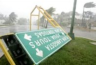 A sign is blown down by high winds in Cancun, Mexico