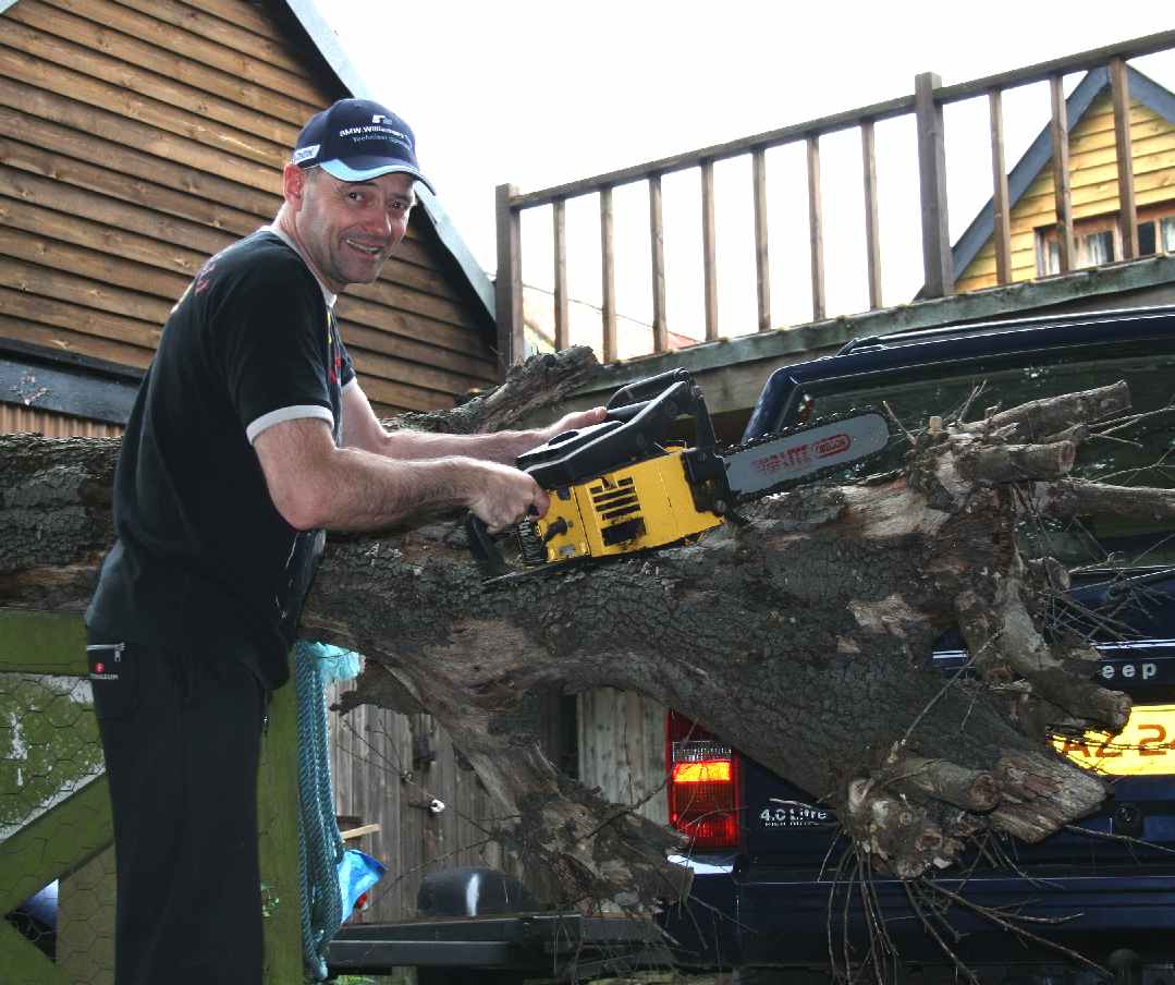 Chain sawing fallen Oak tree to free Jeep, Nelson Kruschandl