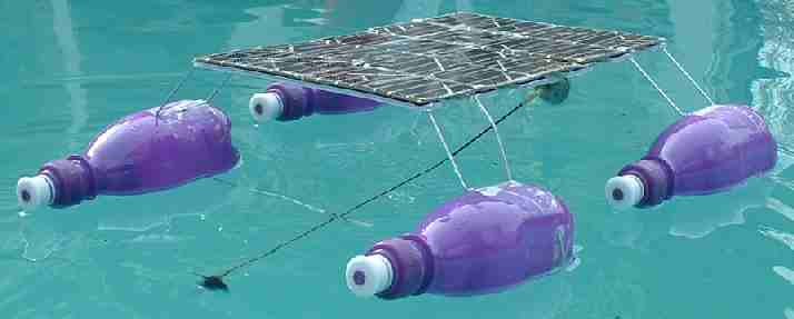 Experimental quad hull (soft drink bottles) model solar powered boat.