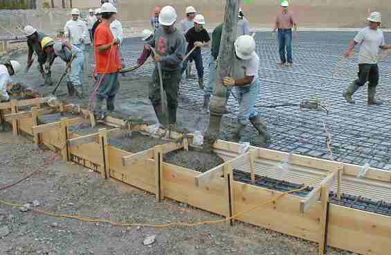 Building a dam using steel reinforced concrete