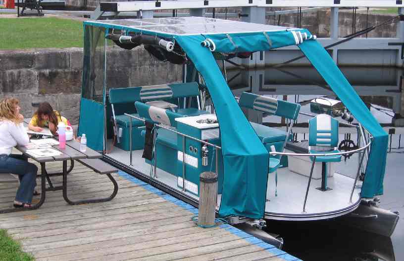 Solar Loon in blue trim production boat docked