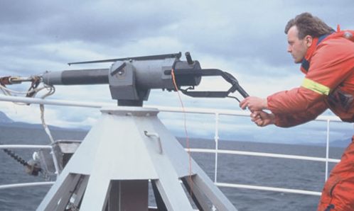 Harpoon operator murdering a whale