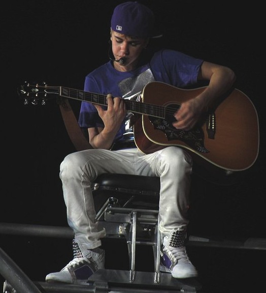 Justin Bieber playing guitar