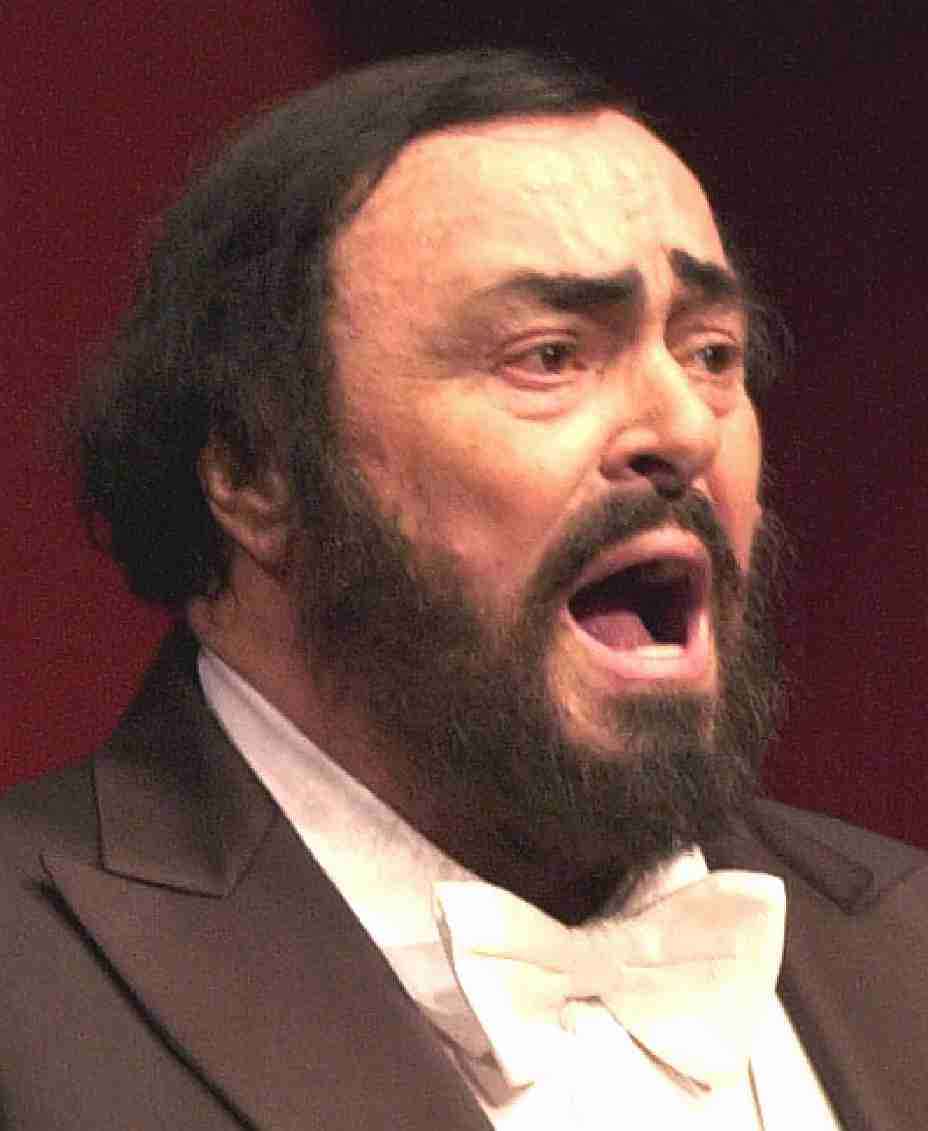 Luciano Pavarotti performing on stage opera tenor