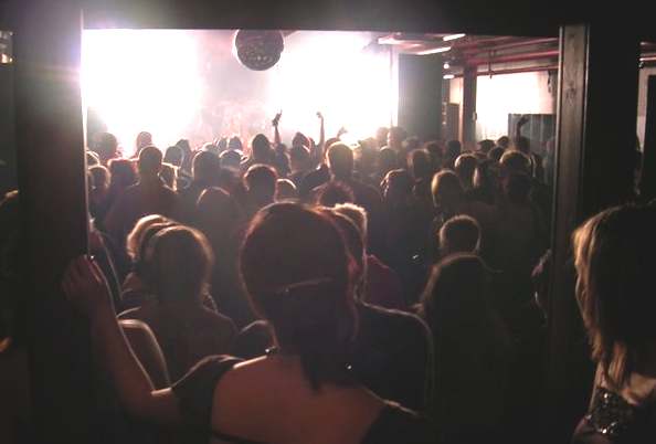 Dancing clubbers at a nightclub