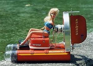 Barbie doll sitting on an electric aerosol model boat from Mexico