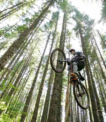 Mountain biker grabbing air Mount Hood National Forest