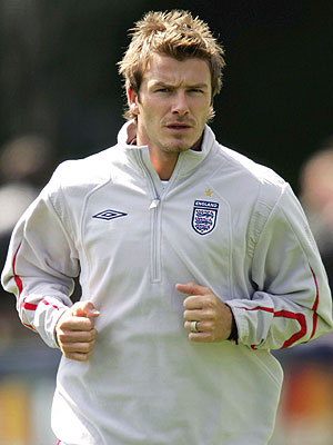 added to right arm and shoulder David Beckham in track suit training added to right arm and shoulder David Beckham in track suit training
