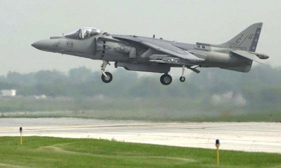 Hovering US Marine Corp AV-8A Harrier, thrust nozzle seen directed along the normal axis