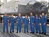 The Discovery crew stands in front of the Space Shuttle that brought them home safely