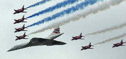 The Red Arrows escort Concorde at the Queens Golden Jubilee flyover of London