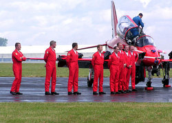 The pilots of the Red Arrows line up for an official photo after their display