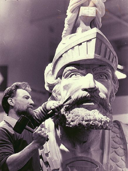 Norman Gaches sculpting the figurhead for HMS Warrior