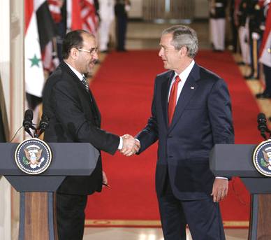 President Bush shakes hands with Iraqi Prime Minister Nouri al-Maliki