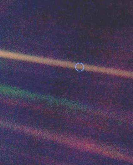 The Pale Blue Dot, a Voyager 1 photo showing Earth (circled) as a single pixel from 4 billion miles away