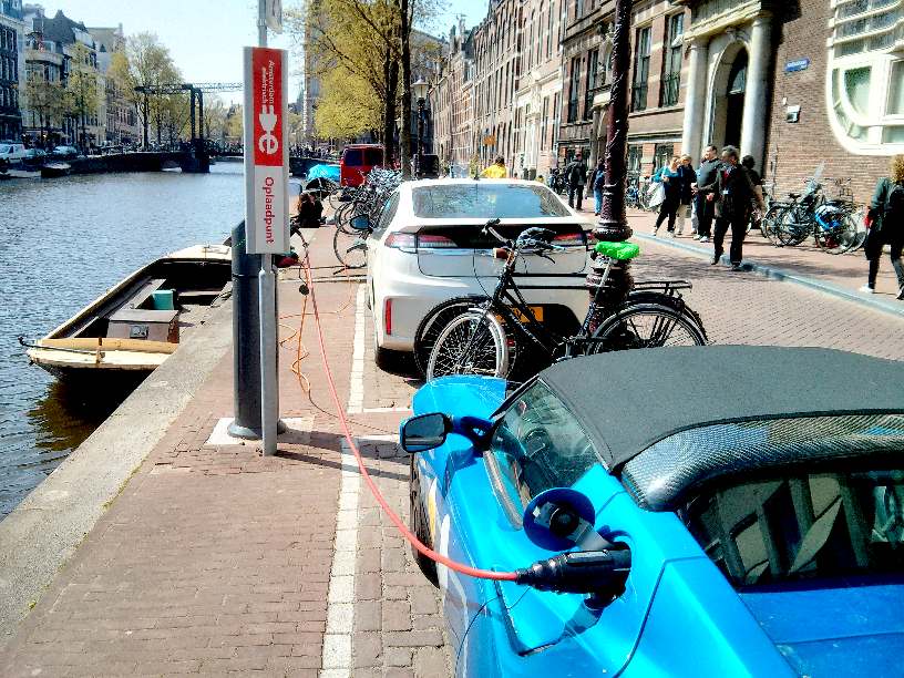 Tesla roadster electric vehicle charging in Amsterdam