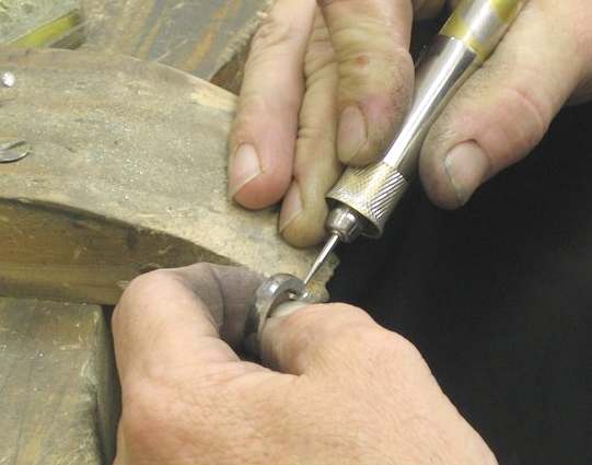 Goldsmith working on a platimum ring