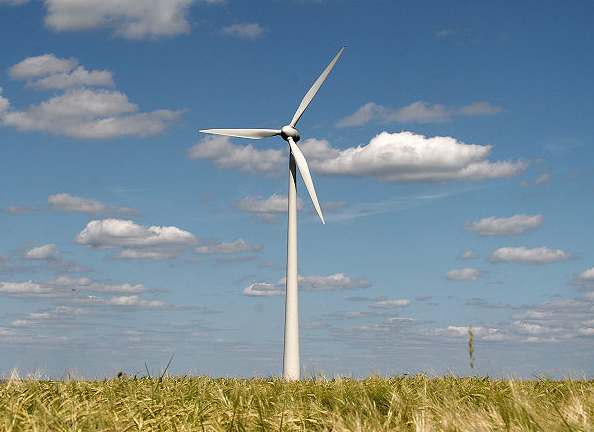 Wind power turbine cloudy country day