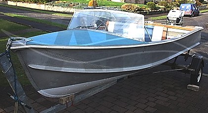 Blue decked Pearly Miss sports boat