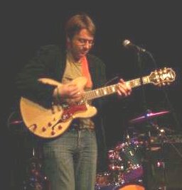 Joel White playing guitar