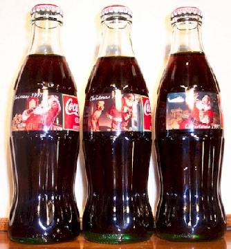 Specially designed Christmas labels featuring Santa Claus on Coca Cola bottles