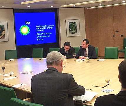 Chief Scientist of BP, Steven Koonin (top right, with computer), speaks about the energy scene in the boardroom in 2005