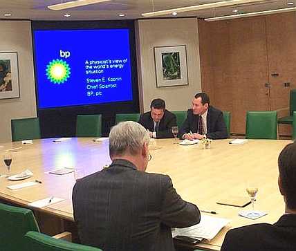 Chief Scientist of BP, Steven Koonin (top right, with computer), speaks about the energy scene in the boardroom in 2005